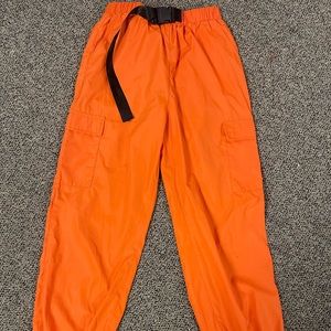 Neon Orange parachute pants with snap buckle